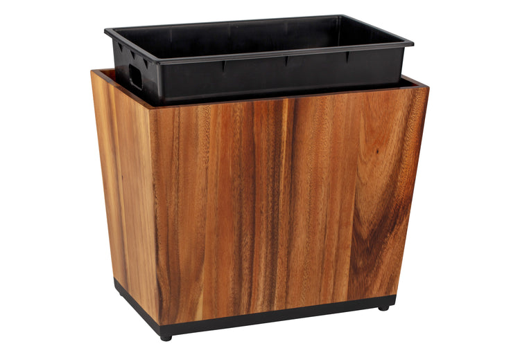 Acacia | Taniya Nayak wastebasket with full liner propped up to see it.