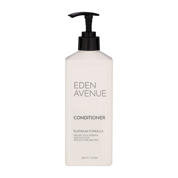 White | Eden Avenue Platinum conditioner pump bottle with a slot hideaway to stick on the wall.