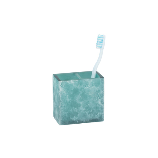 Turquoise | A square teal bathroom toothbrush holder with a white toothbrush inside, set against a plain white background.