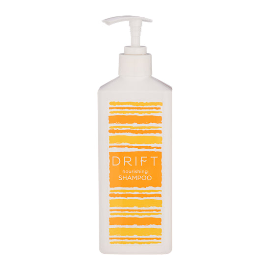 White | Drift shampoo pump bottle with a hideaway slot in the back on a white background.