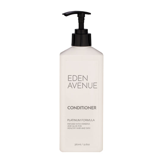 White | Eden Avenue Platinum conditioner pump bottle with a slot hideaway to stick on the wall.