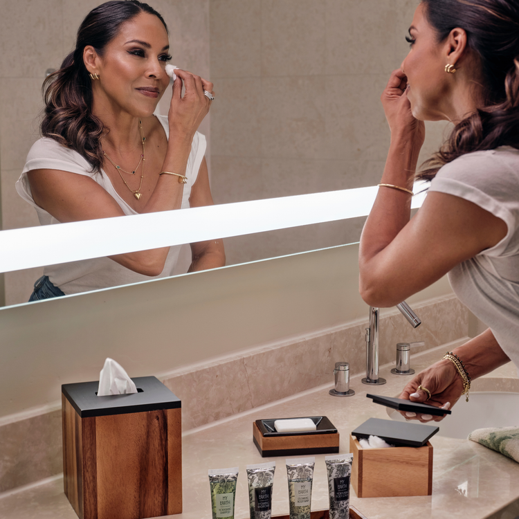 Acacia | Taniya Nayak using the Acacia wood bath accessory set.