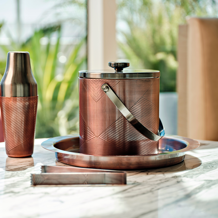 Oil Rubbed Bronze | Taniya Nayak barware set with shaker sitting on a marble table.