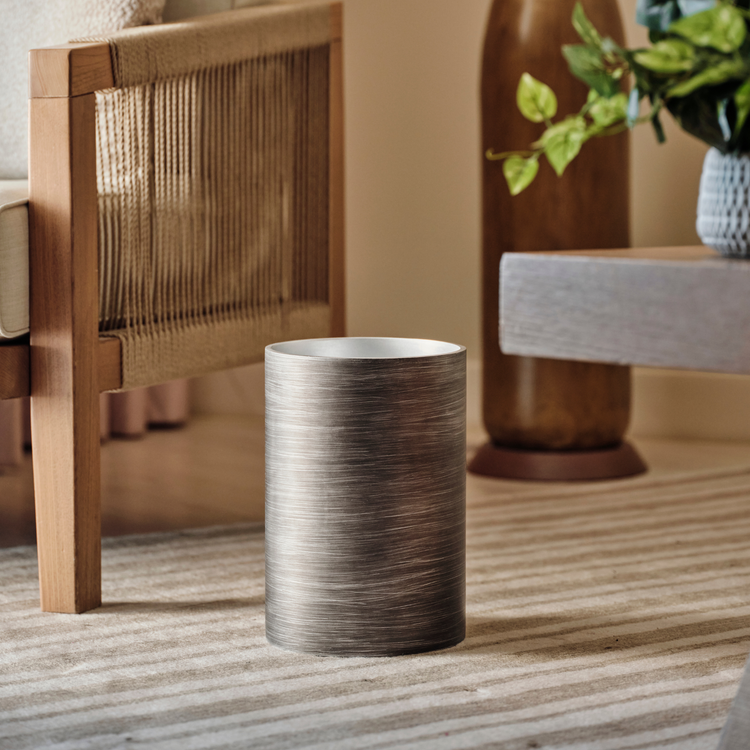 Silver | Taniya Nayak wastebasket placed on a hotel floor.