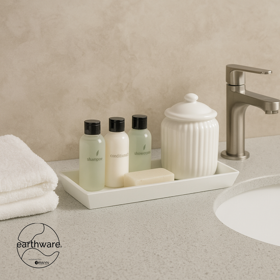 White | Amenity Tray on Bathroom counter with toiletries and a towel, featuring the earthware brand.